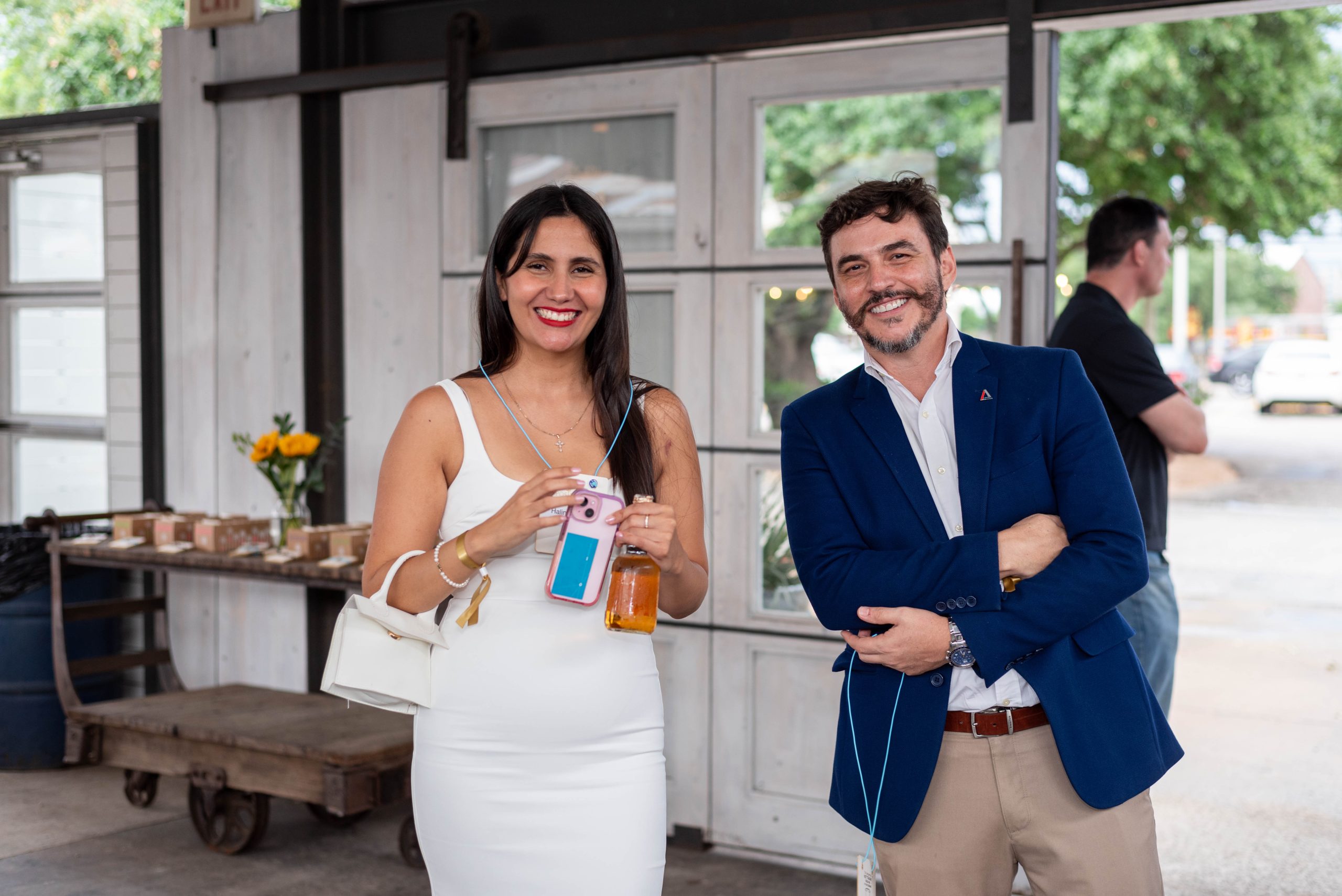Two individuals walking into The Armadillo Palace for a BBQ party
