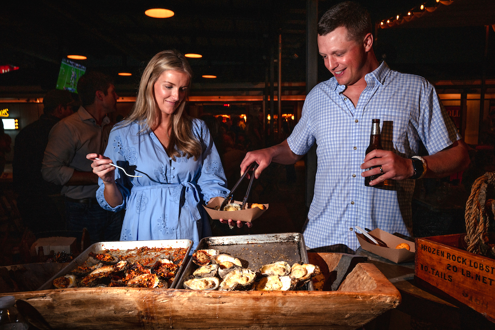 Couple enjoying Goode Co. BBQ for a private event at The Armadillo Palace